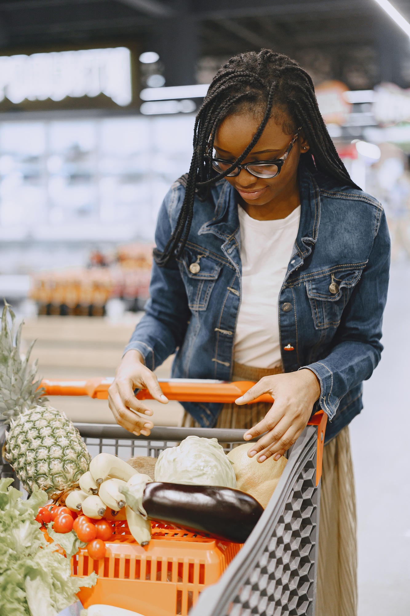 Woman shopping vegetables at the supermarket
